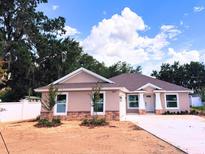 Charming single-story home featuring a manicured yard and inviting architectural details at 803 Allison Place, Bartow, FL 33830