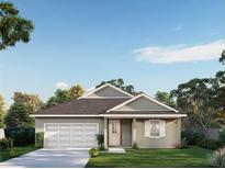 Charming single-story home featuring a covered entry, attached garage, and landscaped front yard at 0 Eagle Lake Loop Rd, Eagle Lake, FL 33839