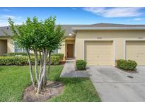 Charming single-Gathering home with a well-maintained lawn and a one car garage at 4089 Shade Tree Ln, Lakeland, FL 33812