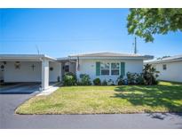 Charming single-story home with well-maintained lawn and vibrant landscaping enhancing curb appeal at 512 Cameo Dr, Lakeland, FL 33803