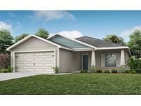 Charming single-story home with a well-manicured lawn, attached garage, and appealing architectural details at 1067 Aruba Ave, Mulberry, FL 33860