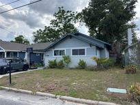 Charming home with lush front yard, showcasing its curb appeal in a serene neighborhood at 1217 King Ave, Lakeland, FL 33803