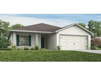Charming single-story home featuring a well-maintained lawn and an attached two-car garage at 1424 Portmore Dr, Mulberry, FL 33860