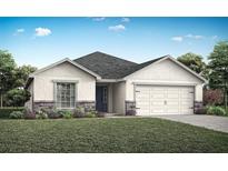 Charming single-story home with a stone-accented facade, well-manicured lawn, and an attached two-car garage at 1429 Fleur Dr, Davenport, FL 33837