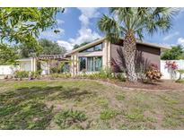 Charming home with landscaped front yard and architectural detailing at 1808 Stonecrest Ct, Lakeland, FL 33813
