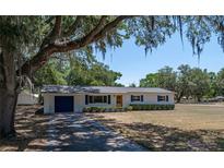 Charming single-story home with fresh exterior paint, shutters, a new roof and a paved driveway at 3705 Garland St, Mulberry, FL 33860
