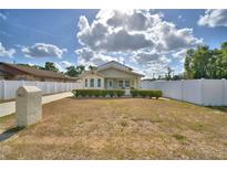 Charming two-story home with a well-manicured lawn and white picket fence, offering classic curb appeal at 640 Waldon N Ave, Bartow, FL 33830