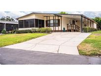 Well maintained single-Gathering home with front yard and long driveway leading up to the front entryway at 1565 Heather Hill Dr, Lakeland, FL 33810