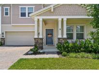 Charming home featuring a welcoming front door and manicured lawn at 4122 Conjunction Way, Apopka, FL 32712