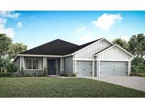 Charming single-Gathering home showcasing a well-manicured lawn and a two-car garage in a suburban setting at 5418 Duxford Cir, St Cloud, FL 34771