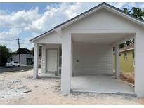 New single story home with a carport and gray trim at 629 W 9Th, Lakeland, FL 33805