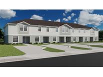 New townhome construction with neutral color scheme and attached parking at 206 Turtle Bay Ave, Winter Haven, FL 33881
