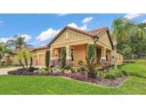 Charming single-Gathering home featuring a tile roof and a meticulously landscaped front yard at 3926 Aquilla Dr, Lakeland, FL 33810
