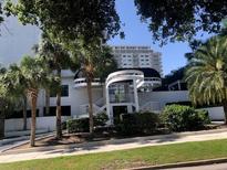 Stunning condominium exterior with an elegant entrance and lush landscaping at 530 E Central Blvd # 405, Orlando, FL 32801
