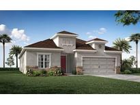 Charming single-Gathering home featuring a two-car garage and beautifully landscaped front yard and neutral exterior at 1368 Melrose St, Lake Alfred, FL 33850