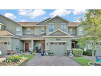 Charming two-story townhome features a one car garage and lovely landscaping at 6435 Sedgeford Dr, Lakeland, FL 33811