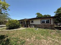 Charming single-story home featuring stone accents and a cozy front yard at 1208 Lowry Ave, Haines City, FL 33844