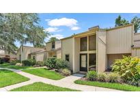 Inviting two-story home with beautiful landscaping and a charming front porch at 30 Aspen Dr # 30, Haines City, FL 33844