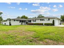 Charming single-story home with a well-manicured lawn and inviting curb appeal at 3810 Harrelson Rd, Lakeland, FL 33810