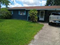 Modest single story home showcasing well-manicured green lawn at 629 W Williams St, Lakeland, FL 33805