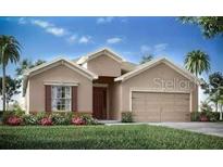 Charming single-Gathering home featuring a two-car garage, neutral color palette, and well-manicured front lawn at 1823 Daystar Dr, Haines City, FL 33844