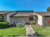 Charming home featuring manicured lawn, garden, and a well-maintained exterior at 2025 Sylvester Rd # P4, Lakeland, FL 33803