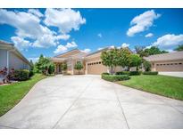 Charming single-story home featuring a well manicured lawn and a spacious driveway at 2425 Laurel Glen Dr, Lakeland, FL 33803