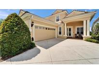 Well maintained home with a two car garage, neutral colors, and manicured front yard at 2464 Laurel Glen Dr, Lakeland, FL 33803
