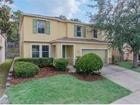 Charming two-story home with a well-manicured lawn and inviting curb appeal at 143 Alfani St, Davenport, FL 33896