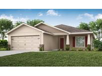 Charming single-story home featuring a two-car garage and well-maintained lawn at 1851 Daystar Dr, Haines City, FL 33844