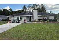 Charming single story home with a spacious front yard and landscaped garden at 3646 Sherertz Road, Lakeland, FL 33810