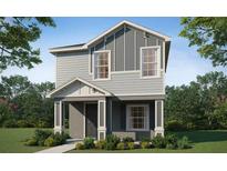 Charming two-story home with neutral siding, covered porch, and professionally landscaped front yard at 470 Windy Willow Way, St Cloud, FL 34771
