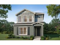 Charming two-story home featuring vertical siding, large windows and a welcoming front porch at 485 Silverbell Trl, St Cloud, FL 34771