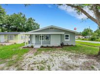 Charming single-story home features a covered front porch and updated landscaping, providing great curb appeal at 3601 Avenue R Nw, Winter Haven, FL 33881