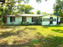 Charming single-story home featuring a neatly landscaped front yard and a welcoming entrance at 4629 Harden Blvd, Lakeland, FL 33813