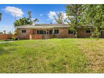 Charming brick home with a well-maintained lawn and classic curb appeal at 545 Prado Pl, Lakeland, FL 33803