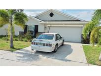 Charming single-story home with a well-maintained lawn and a two-car garage at 550 Patton Loop, Bartow, FL 33830