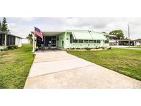 Charming single-story home with well-maintained lawn and a concrete driveway at 1610 Reynolds Rd # 204, Lakeland, FL 33801