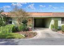 Charming single-story home featuring an open carport, well-maintained landscaping, and a welcoming front entrance at 2203 Starboard, Winter Haven, FL 33881