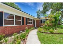 Charming brick home featuring manicured landscaping, a welcoming walkway, and a classic design at 2632 Handley Blvd, Lakeland, FL 33803
