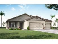 Charming single-story home featuring a three-car garage and well-manicured front lawn at 848 Cypress Creek Run, St Cloud, FL 34771
