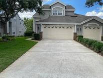 Charming two-story home with a spacious two-car garage and well-manicured lawn at 1117 Stonebrooke Ln # 58, Lakeland, FL 33803