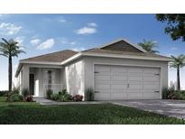 Charming single-story home with a two-car garage, well-manicured lawn, and lush landscaping at 2230 Oldham Ct, Haines City, FL 33844