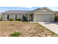 Charming single-Gathering home with a two-car garage and green lawn at 367 Cloverdale Rd, Winter Haven, FL 33884