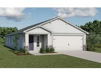 Charming single-story home showcasing a two-car garage, well-manicured lawn, and welcoming front entry at 424 Ituna Cir, Winter Haven, FL 33881