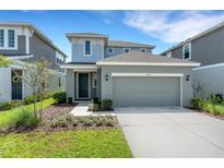 Charming two-story home with well-maintained landscaping and a two-car garage at 6261 Great Bear Dr, Lakeland, FL 33805