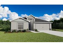 Charming single-Gathering home showcasing a well-manicured lawn and a two-car garage at 7534 Sw 108Th St, Ocala, FL 34476