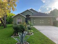 Charming single-Gathering home with beautiful landscaping and well-maintained lawn at 1011 Tequesta Trl, Lake Wales, FL 33898