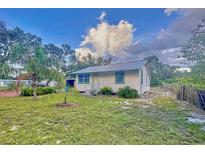 Charming home featuring freshly cut green grass and a well-maintained landscape at 200 Spurlock Rd, Frostproof, FL 33843