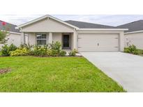 Charming single-story home with a well-maintained lawn and inviting curb appeal at 3135 Laurel Oak Ln, Winter Haven, FL 33884